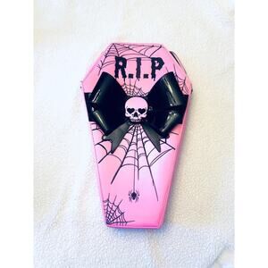 Dolls Kill Pink coffin backpack
